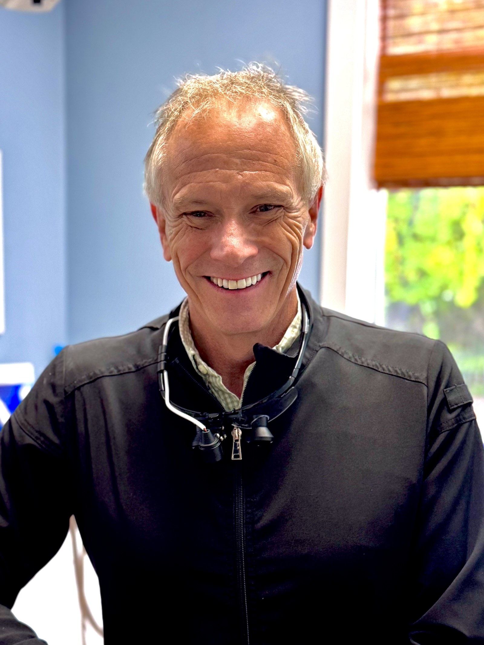 Dr. Jeff Blank smiling in the treatment room at Southern Tides Dentistry